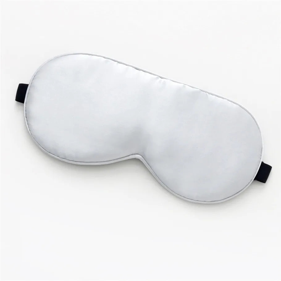 white silk sleeping mask on a white background