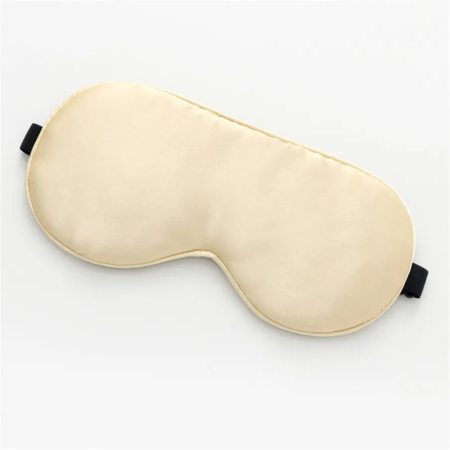 beige, silk sleeping mask on a white background