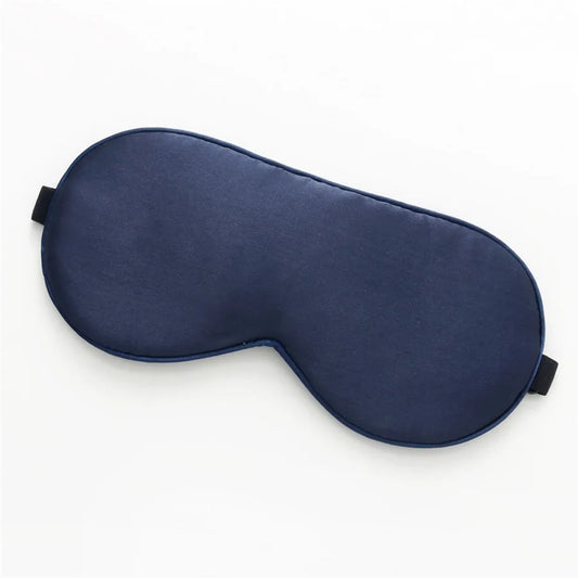 dark blue silk sleeping mask on a white background