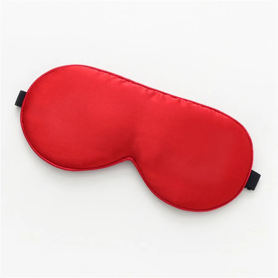 red, silk sleeping mask on a white background